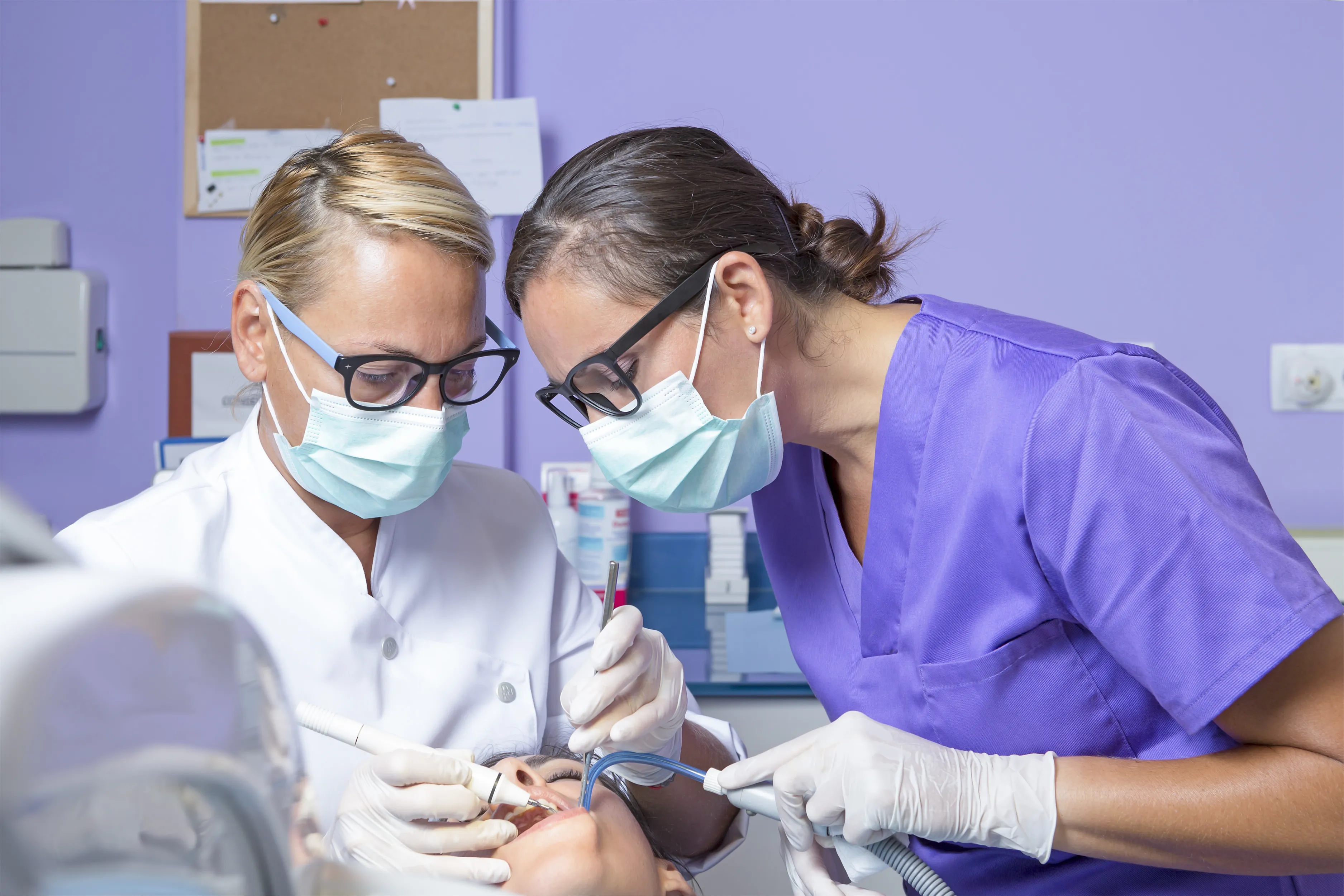 Dental assisting students practicing chairside skills in the ASDA clinic