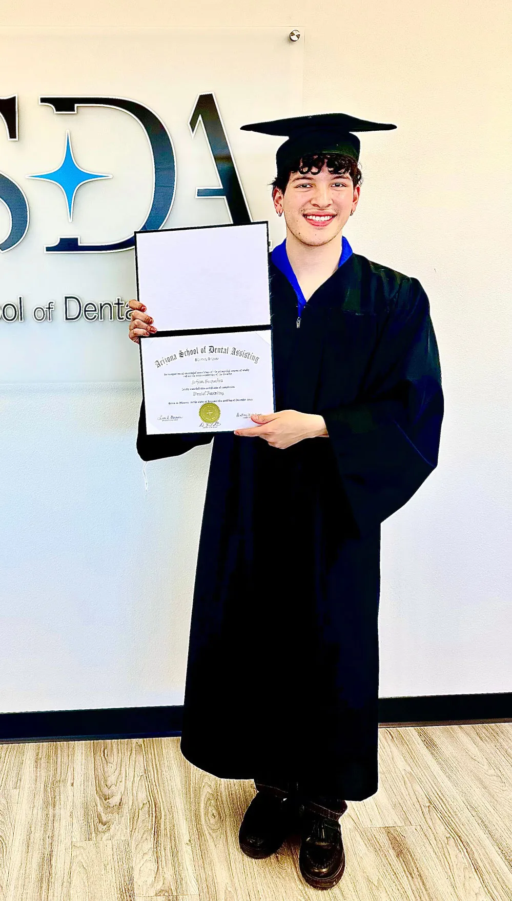 An ASDA graduate celebrating at commencement