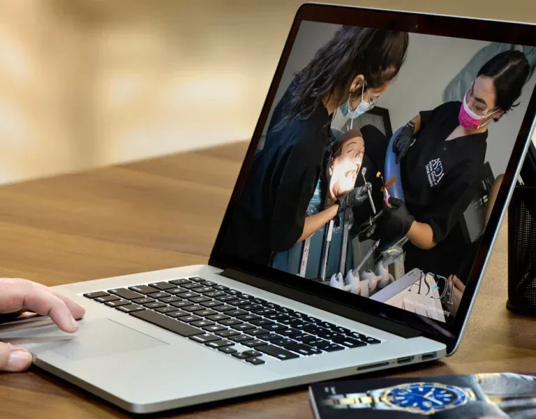 Reviewing ASDA's online clinical lessons on a laptop