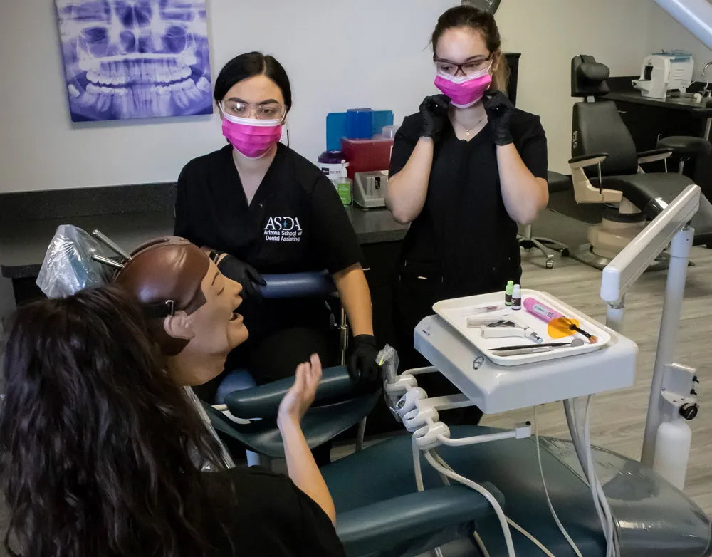 ASDA students working chairside during clinical training